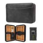 Black leather cigar travel case, opened to show wooden cigar dividers, a small humidification gauge, and a strap-secured pouch inside; lighter sits nearby.