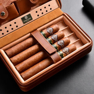 Open brown leather cigar humidor containing five cigars with green bands and a Cigarlounge label visible on the tray edge.