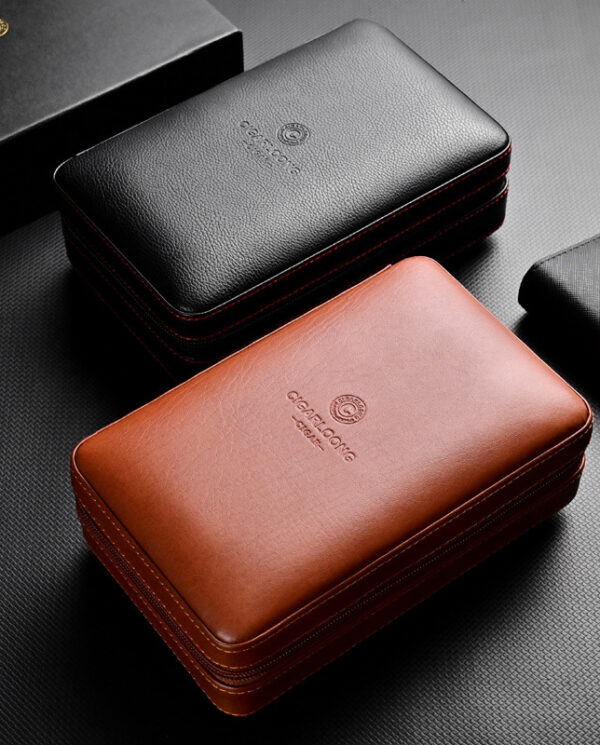 Two leather zip cases, black and brown, with subtle embossed logos on a dark textured surface.