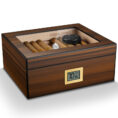 Wooden cigar humidor with glass top, cigars inside and a digital humidity/temperature display on the front.