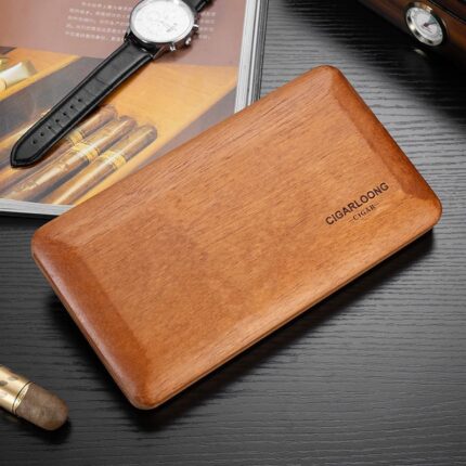 Slim CigarLoong cedar wood travel cigar case on a dark desktop