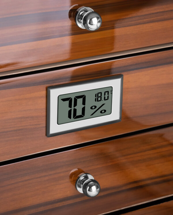CH005-02 Digital humidity and temperature display on a wooden dresser showing 70% humidity and 18.0°C (built-in monitor).