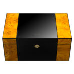Luxurious black lacquer storage box with burl wood panels on the sides and a gold lock.