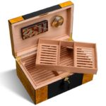 Open black lacquer humidor showing tiered cedar cigar trays