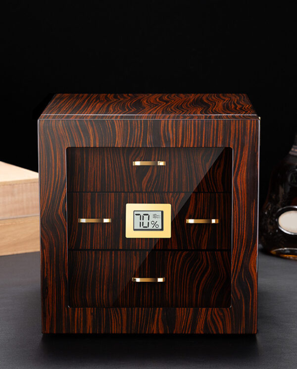 CH007-01 Wooden cigar humidor with glass front and gold handles, digital humidity display reading 70% inside a dark room.
