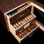 Open two-drawer cedar cigar humidor cabinet filled with cigars