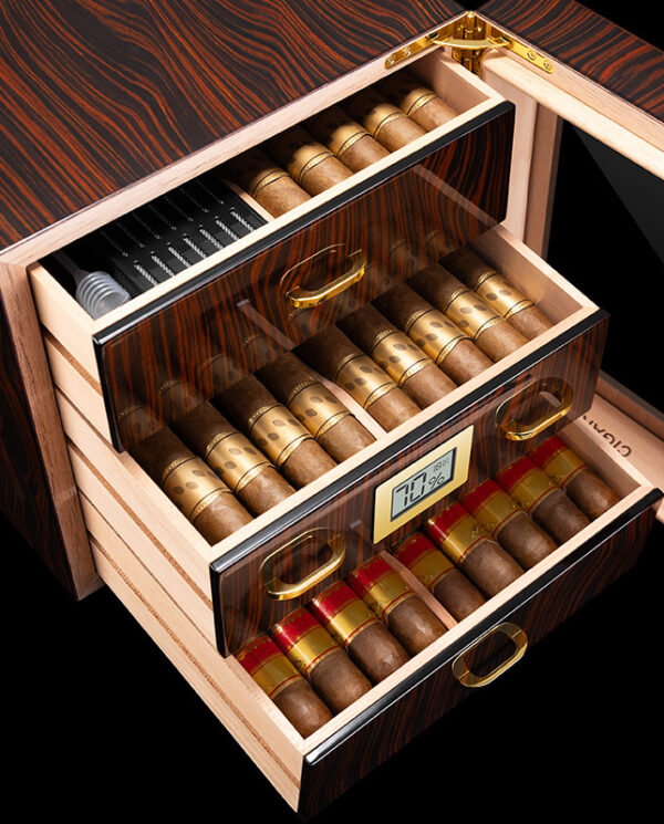 CH007-03 Wooden cigar humidor with two open drawers packed with cigars; a digital hygrometer display visible on the front, and a small humidifier tray in the top drawer.
