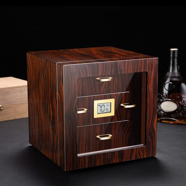 CH007 Wooden cabinet-style device with a small digital humidity display showing 70% and gold drawer handles on a dark surface.