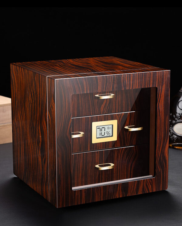 CH007 Wooden cabinet-style device with a small digital humidity display showing 70% and gold drawer handles on a dark surface.