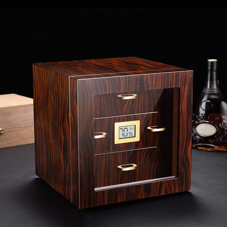 Wooden cabinet-style device with a small digital humidity display showing 70% and gold drawer handles on a dark surface.