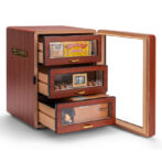 Wooden cigar humidor with three drawers, open door showing cigars and a digital humidity gauge.