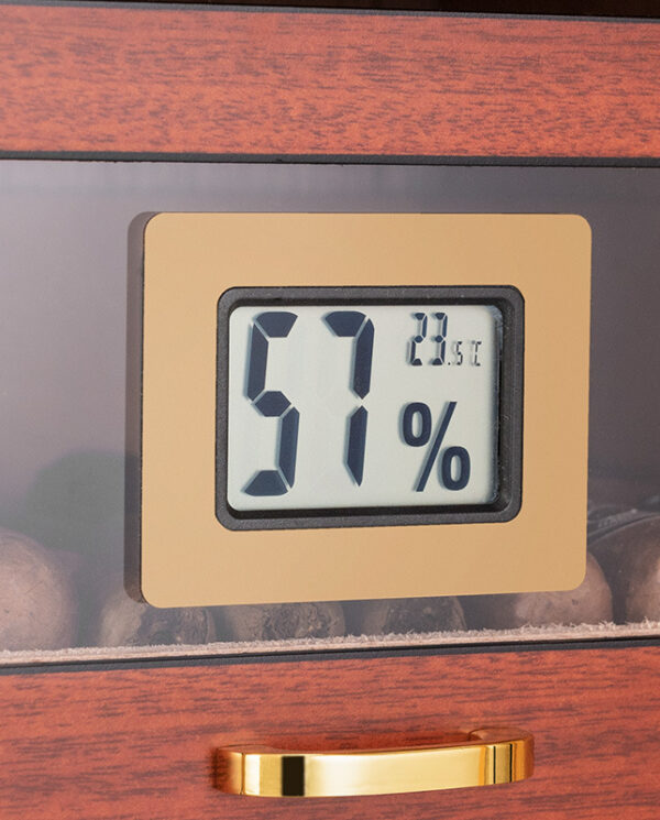 CH008-02 Digital humidity gauge showing 57% inside a wooden cigar humidor.