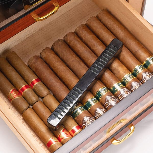 CH008-03 Open wooden humidor with many cigars and a black rectangular humidifier resting across them.