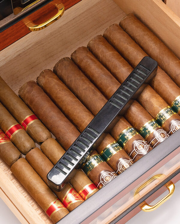 CH008-03 Open wooden humidor with many cigars and a black rectangular humidifier resting across them.