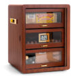 Wooden cigar humidor with four glass-front drawers and gold handles, cigars visible inside, humidity gauge shows 57%.