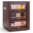Wooden cigar humidor with glass-front drawers displaying Partagás cigars, a digital hygrometer showing 51% humidity, and a Trinidad box in the bottom drawer.