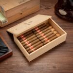 Open Spanish cedar travel cigar box filled with individually wrapped cigars