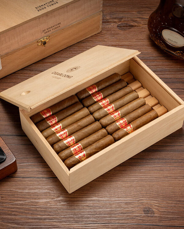 CH009-01 Open wooden cigar box filled with wrapped cigars on a wood table surface.