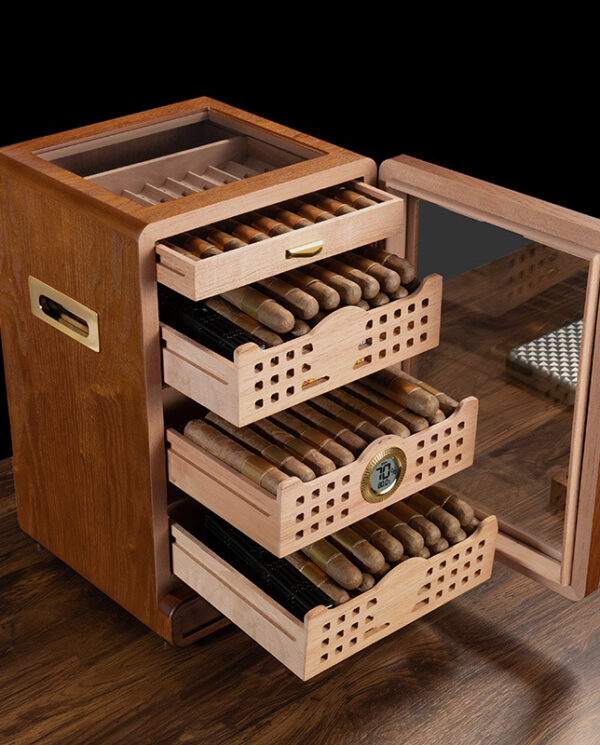 CH010-01 Open wooden cigar humidor with four sliding trays of cigars, a built-in hygrometer, and a glass door on a wooden table