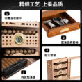 Infographic of a wooden cabinet highlighting features: built-in temperature/humidity gauge, smoking accessory drawer, built-in humidifier, and large capacity