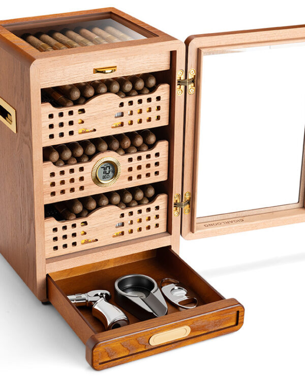 CH010-04 Open wooden cigar humidor with glass lid; displays cigars on shelves and a drawer containing cigar cutters and a lighter.