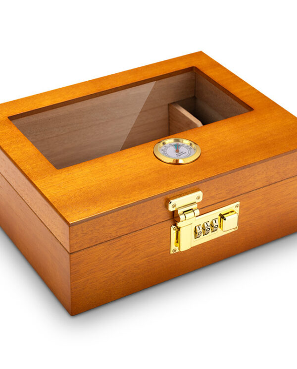 Wooden humidor with a glass top, brass lock, and humidity gauge for storing cigars.