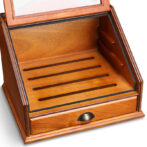 Open wooden jewelry display case with four grooves for rings and a bottom drawer.