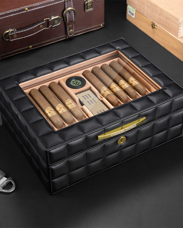 CH014-01 Black quilted leather cigar humidor with a glass lid, showing cigars neatly arranged inside and a small hygrometer visible on the top panel.