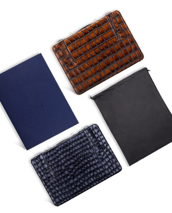 CH015-04 Four leather accessories on a white background: brown crocodile wallet, navy crocodile wallet, dark blue folder, and black drawstring pouch.