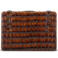 Brown crocodile-embossed leather clutch with two vertical strap tabs on top edge, rectangular shape, no visible branding.