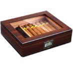 Wooden cigar humidor with glass top displaying cigars inside and a digital hygrometer on the front.
