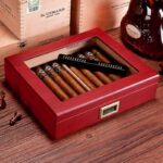 Open rosewood clear-top cigar humidor with cigars and digital hygrometer