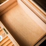 Close-up of the cedar interior and hygrometer inside the LUBINSKI humidor