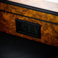 Digital humidity and temperature display embedded in a burl wood panel showing 54% and 26.7°C.