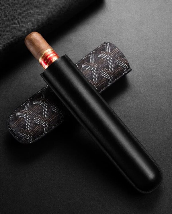 CL030-02 Brown cigar with red band in a black leather cigar sleeve laid on a dark background; a patterned case sits beneath the cigar.