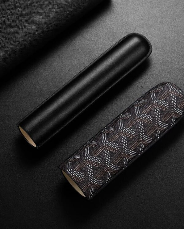 CL030-03 Two cylindrical cosmetic cases, one plain black and one brown patterned, on a dark surface.