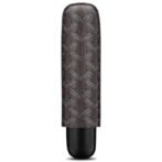 Cylindrical makeup tube with a brown geometric patterned sleeve and a black rounded cap standing upright on a white background.