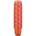 Orange lipstick in a patterned translucent case with a curved cap, standing upright.