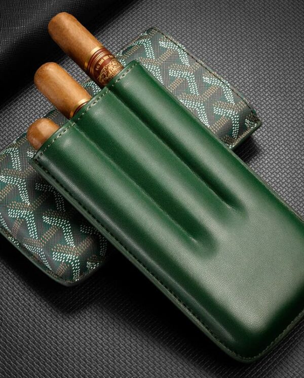 CL031-03 Green leather cigar holder with two cigars partially visible beside a patterned case on a dark background.