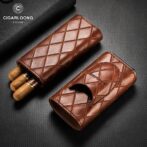 Brown quilted leather cigar cases, one open with three cigars visible, on a textured black background (brand logo in corner).