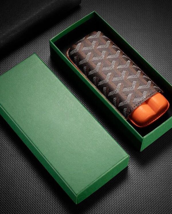 CL033-04 Brown patterned leather wallet inside an open green gift box on a dark surface, gift-ready look.