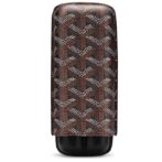 Geometric brown and white patterned zip pouch with a black leather base.