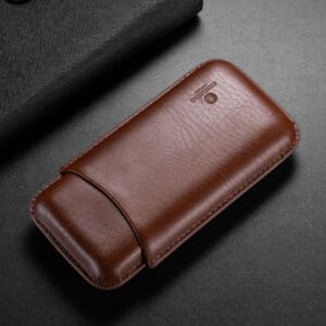 Brown leather wallet-style phone case with a curved flap on a dark surface.
