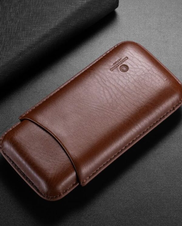 CL035-01 Brown leather wallet-style phone case with a curved flap on a dark surface.