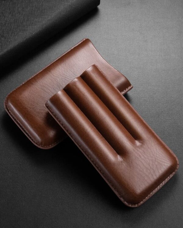 CL035-02 Brown leather case with three rounded slots, likely a pen or tool holder, on a dark surface.