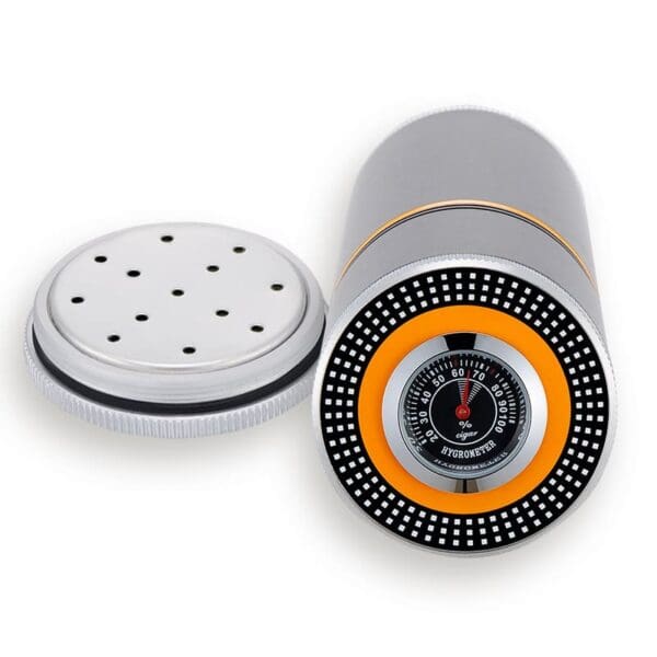 CL038-03 Cigar humidor hygrometer device with a perforated metal cap and a circular dial showing humidity around an orange ring.