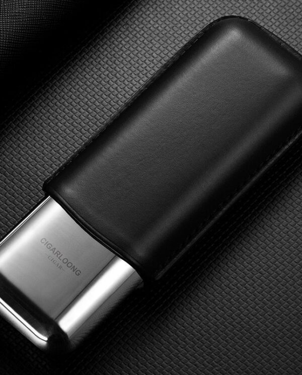 CL042-01 Luxury lighter sheathed in black leather resting on a textured dark surface.