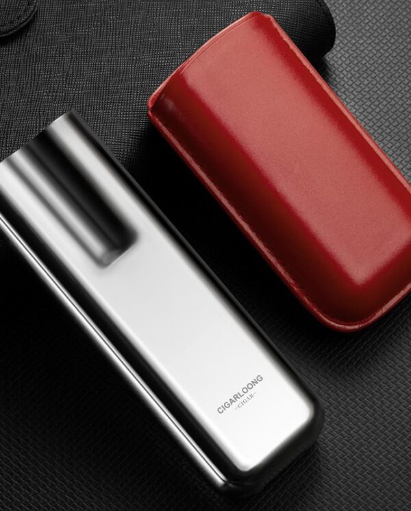 CL042-02 Silver vape device with black mouthpiece beside a red leather carry case on a dark textured surface.