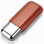 Close-up of a metal lighter wrapped in a brown leather sleeve, diagonally oriented on a white background