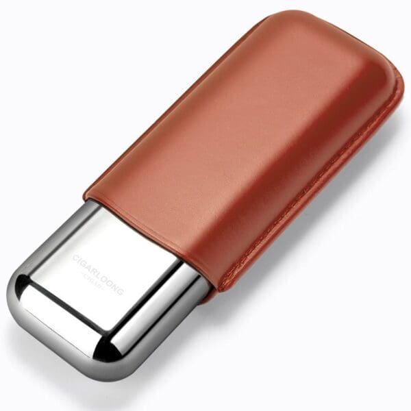 CL042-06 Close-up of a metal lighter wrapped in a brown leather sleeve, diagonally oriented on a white background